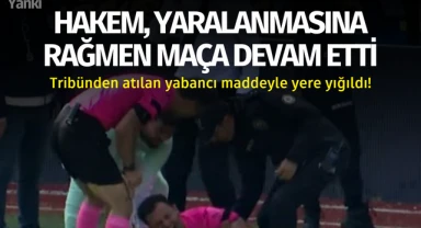 Hakem, yaralanmasına rağmen maça devam etti.. Tribünden yabancı madde atıldı!